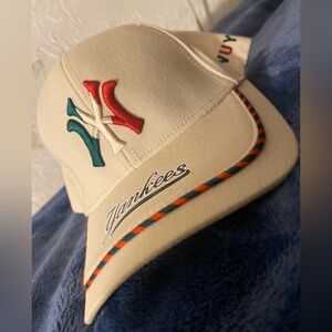 While Yankees baseball hat